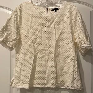 Open knit short sleeve top.